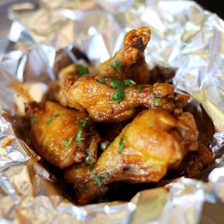 Confit chicken wings with choice of sauce. (Sundays only)